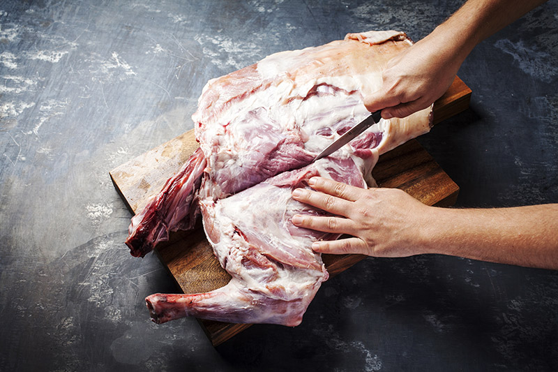Staying as close to the ribs as possible. slice the leg away from the neck and rib set carefully.