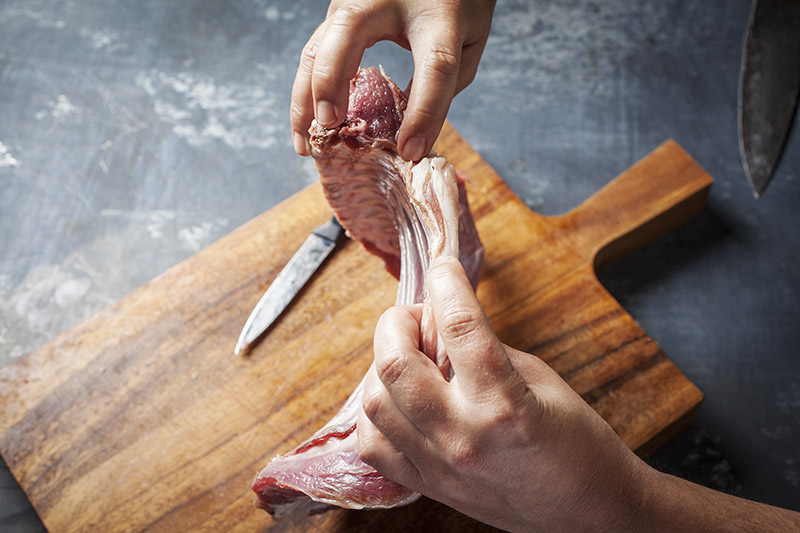 Remove any excess fat from the ribs. I denitrify the eye muscle in the rack and decide not wether to leave it whole or to separate them into chops.