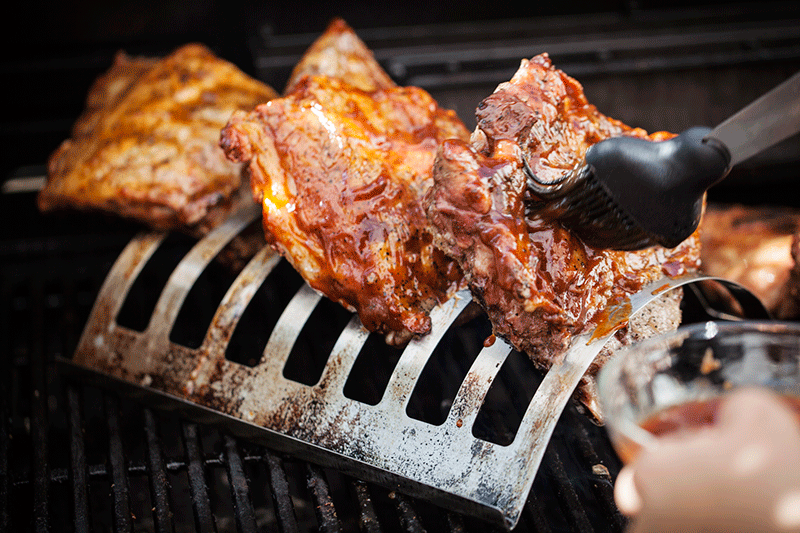 Continuing in the same manner, baste the ribs in the front portion of the rack with your favourite smakey BBQ sauce. 