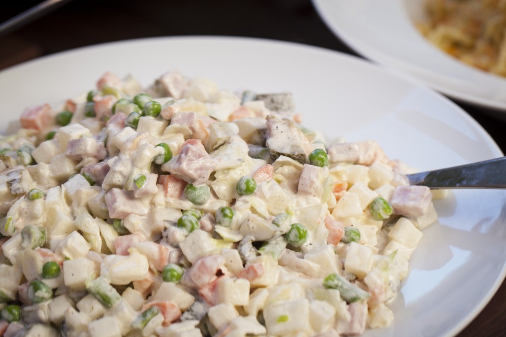 Salad Olivier, known as Ensalada Rusa in Argentina, is commonly served alongside Asado. It's a mix on potatoes, ham (or tuna), peas, carrots and beans in a tangy mayonnaise dressing. 